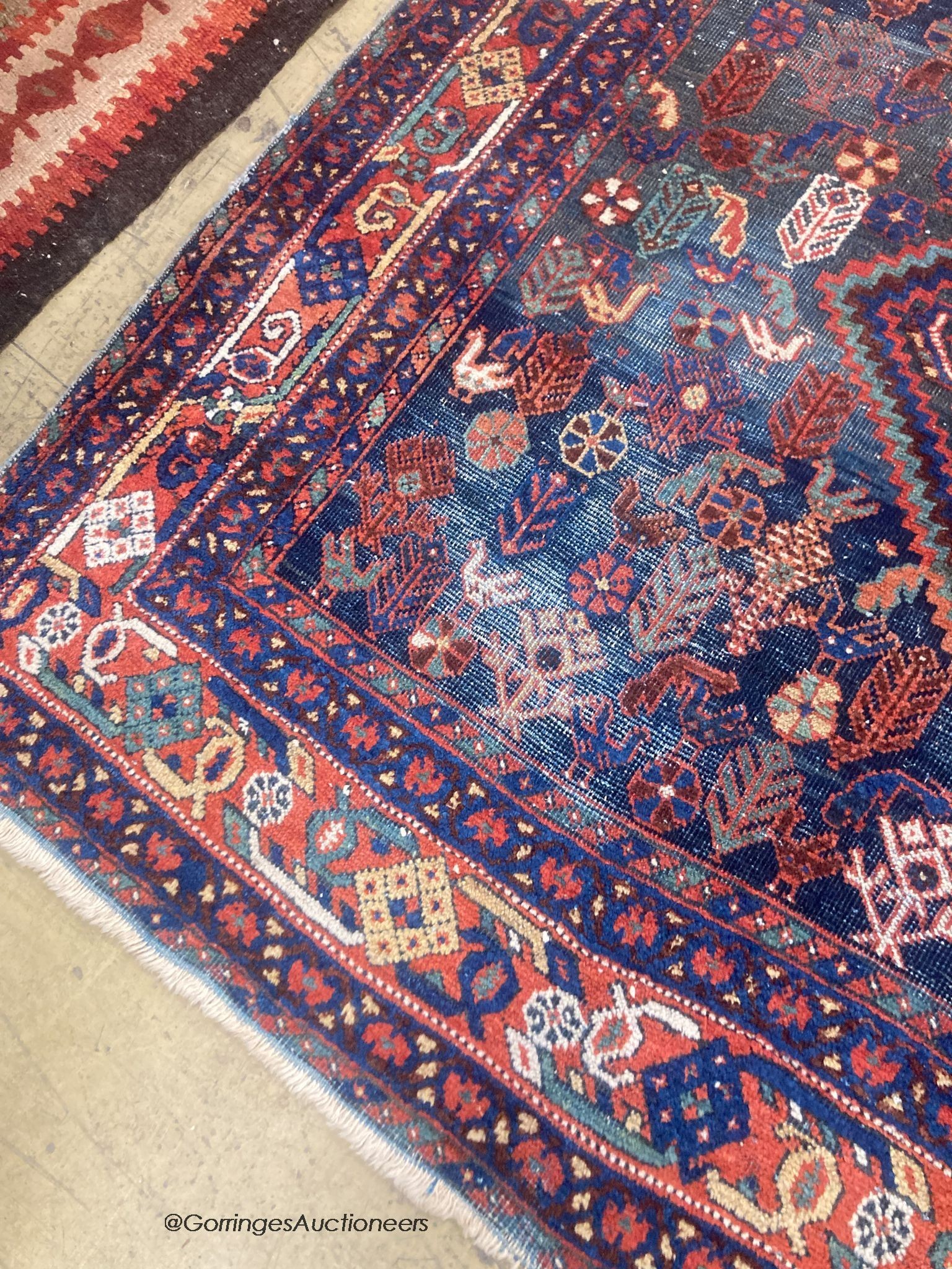 A Caucasian blue ground rug, 188 x 154cm